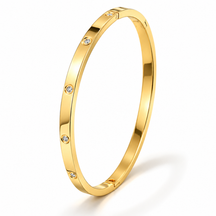 A polished yellow gold bangle bracelet with evenly spaced small round clear stones, shown on a clean white background.
