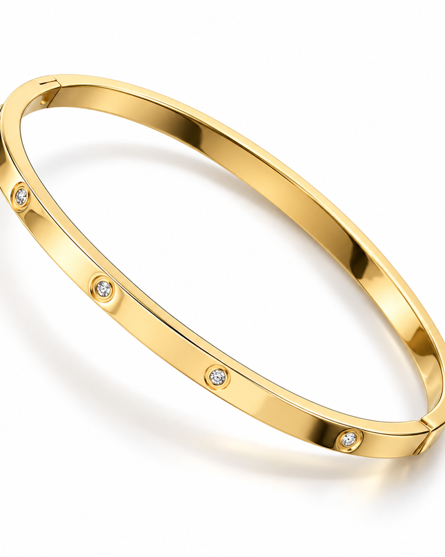 A polished yellow gold bangle bracelet with five small bezel-set clear stones spaced evenly along the band, shown on a clean white background.