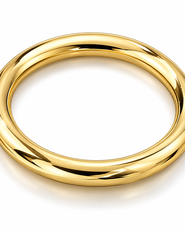 A polished yellow gold bangle ring with a thick, rounded profile, shown on a clean white background with a soft shadow.